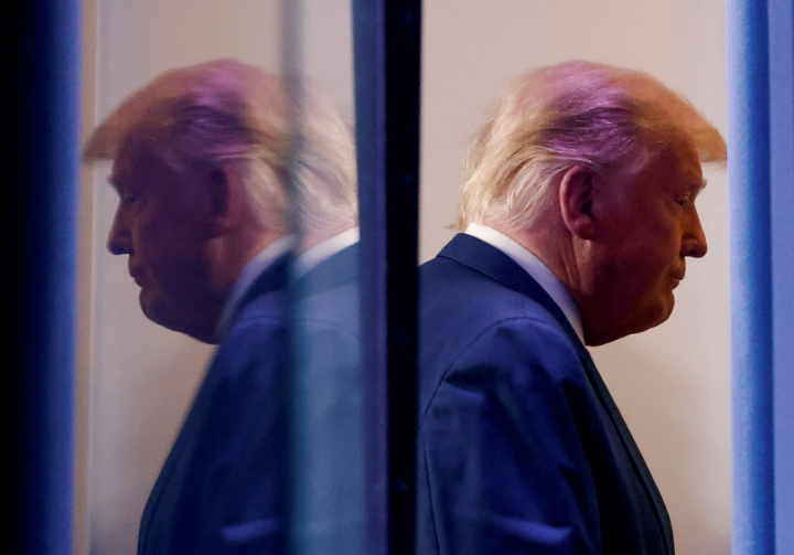 U.S. President Donald Trump is reflected as he departs after speaking about the 2020 U.S. presidential election results in the Brady Press Briefing Room at the White House in Washington, U.S., November 5, 2020