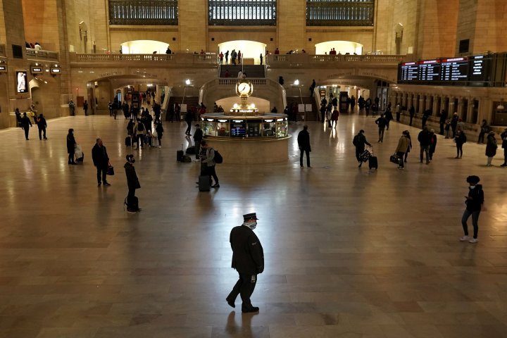 A conductor walks through Grand Central Terminal the day before Thanksgiving during the coronavirus disease (COVID-19) pandemic in the Manhattan borough of New York City, New York, U.S., November 25, 2020. REUTERS/Carlo Allegri 