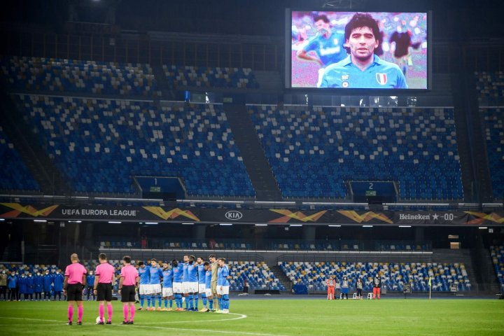 A screen displays a photo of the late Diego Maradona as players hold a minute of silence in homage to late Argentinean striker prior to the UEFA Europe League Group F football match between Napoli and Rijeka on the San Paolo stadium in Napoli.