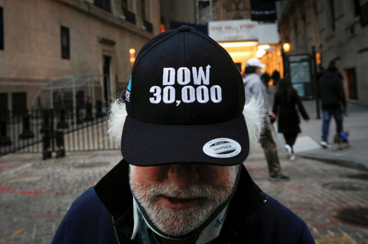 Wall Street rises, Nasdaq hits record high on recovery hopes