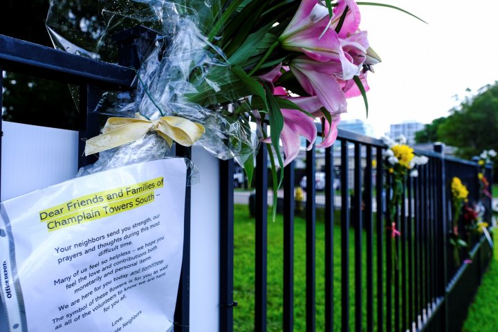 Flowers and note memorial Champlain Towers South