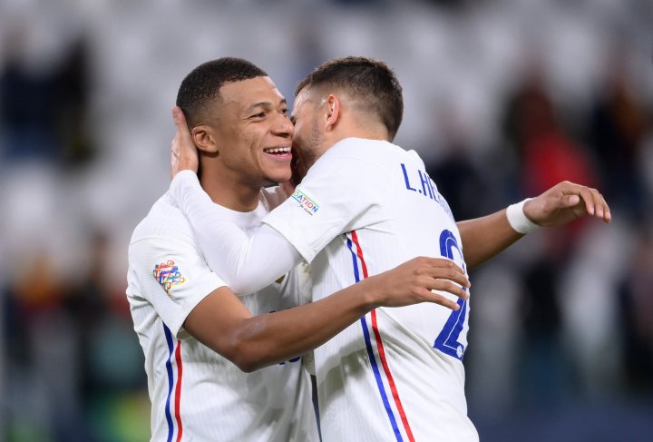 Kylian Mbappe and Lucas Hernandez of France celebrate their side's victory after the UEFA Nations League 2021 Semi-final match between Belgium and France at Juventus Stadium on October 07, 2021 in Turin, Italy. 