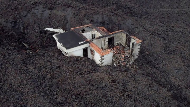 House on La Palma surrounded by volcanic lava