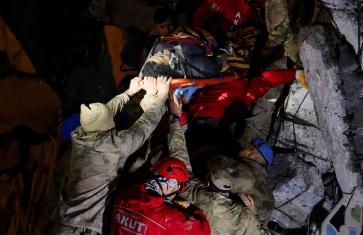 A man is rescued from the rubble of a collapsed hospital in Iskenderun, Turkey.
