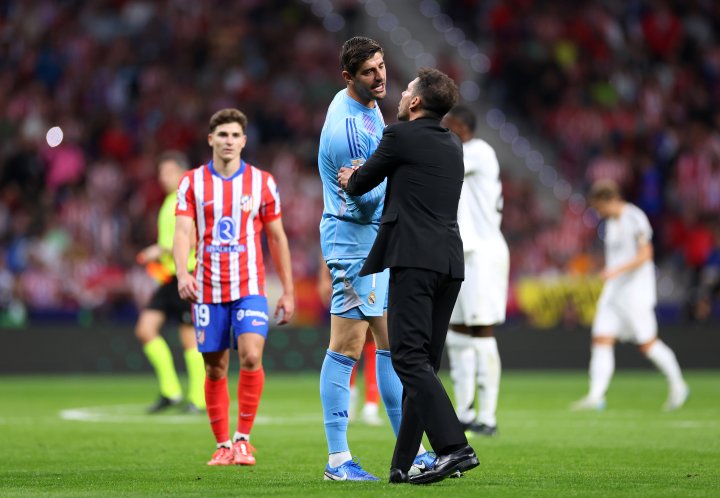 Courtois y Simeone, ayer en el derbi